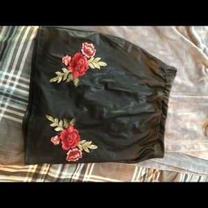 black faux leather rose skirt